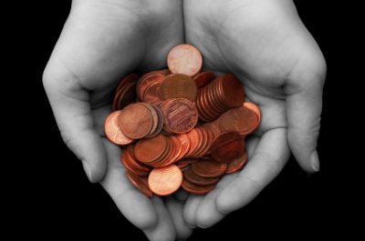 A hand full of change.