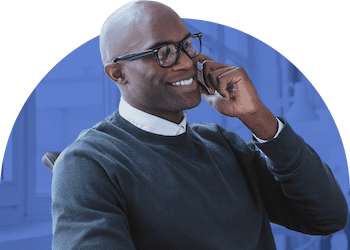 A smiling consultant talking on the phone