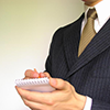 A businessman taking notes.